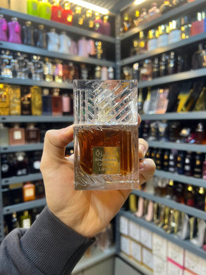 a person holding up a glass in a store