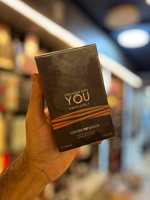 a person holding up a box of chocolate