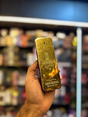 a hand holding a gold bar in a store