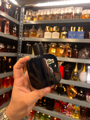 a person holding a small black object in their hand