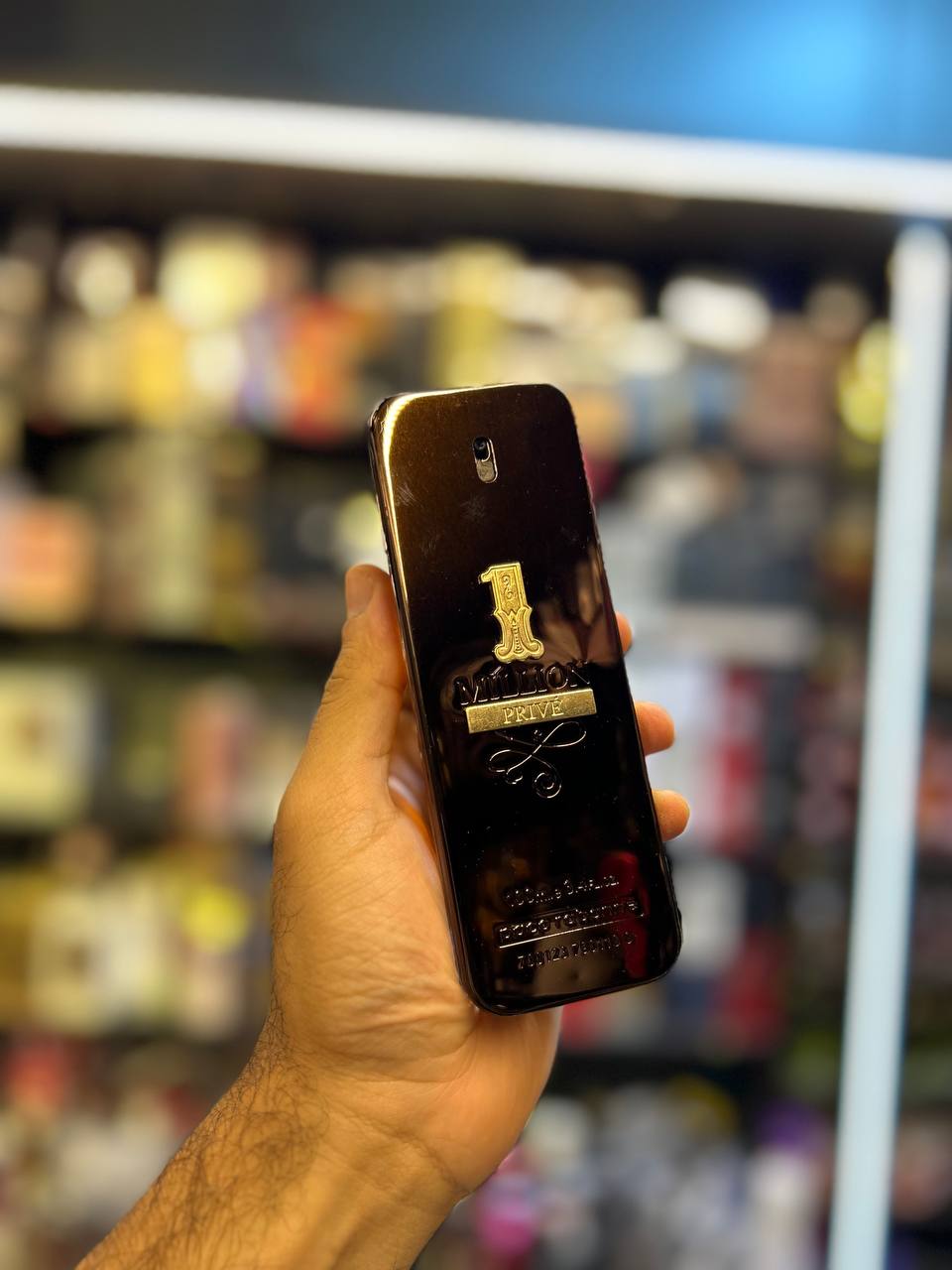 a person holding a cell phone in their hand