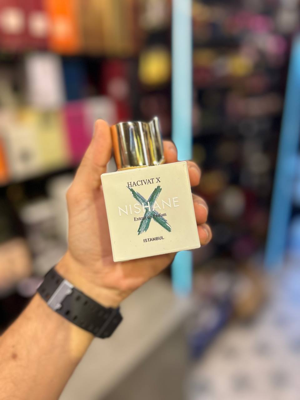 a person holding up a package of cigarettes