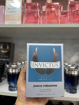 a person holding up a business card in a store